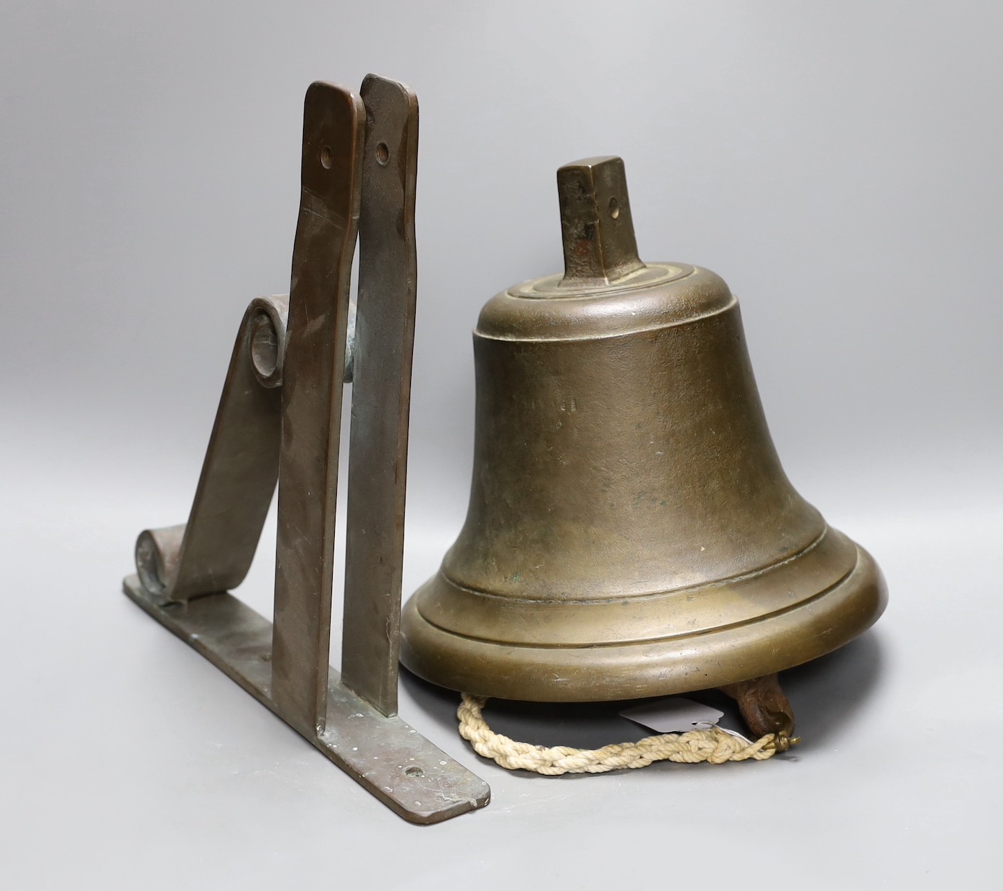 A ship's bell, 25cm diam, and bronze bracket